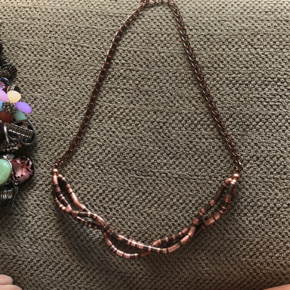 Brown accent necklace.